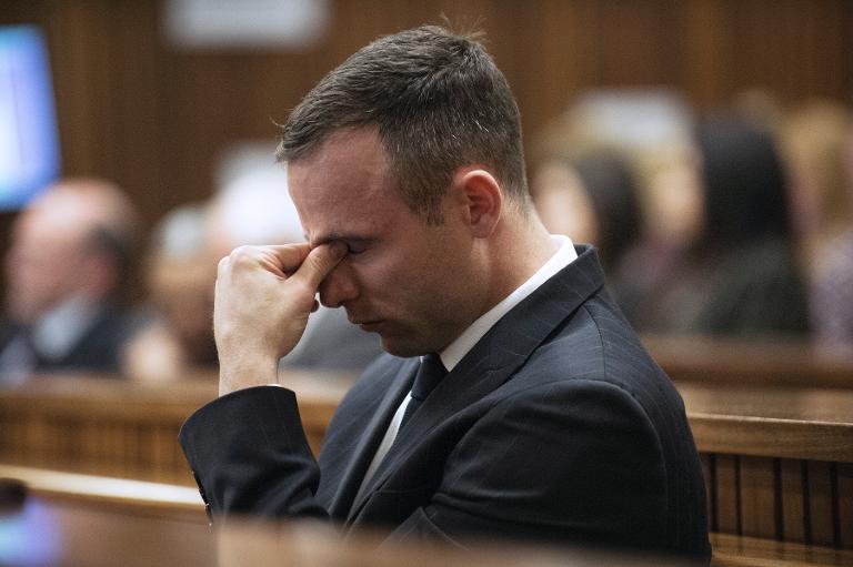 Oscar Pistorius said he shot Reeva Steenkamp four times through a locked toilet door on Valentine's Day 2013 in the belief she was an intruder. (Photo : AFP) Oscar Pistorius said he shot Reeva Steenkamp four times through a locked toilet door on Valentine's Day 2013 in the belief she was an intruder. (Photo : AFP)